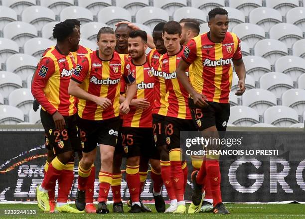 Lens' French midfielder Gael Kakuta is congratuled by team mates after scoring a goal during the French L1 football match between Lens and Lorient at...