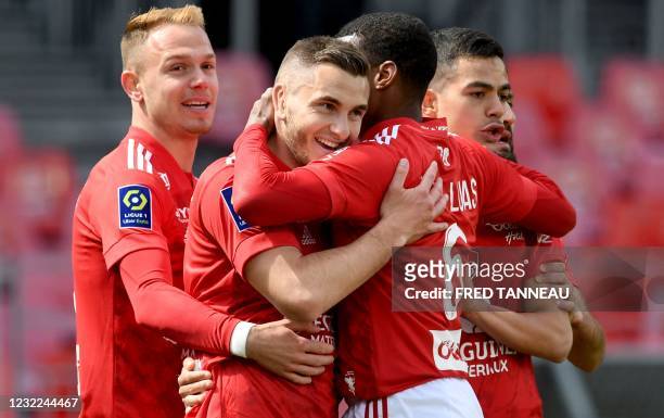 Brest's French defender Brendan Chardonnet is congratulated by his teammates after scoring during the French L1 football match between Stade Brestois...