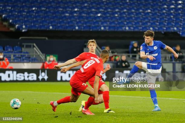 Schalke's Dutch forward Klaas-Jan Huntelaar shoots but fails to score during the German first division Bundesliga football match between FC Schalke...