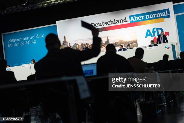 Delegates vote on an amendment on the second day of the congress of far-right Alternative for Germany party in Dresden, eastern Germany, on April 11,...