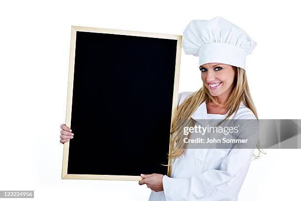 cute chef holding a blackboard for copy space - chefs whites stock pictures, royalty-free photos & images