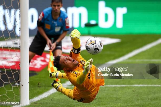 Diego Alves of Flamengo defends a penalty kick during a penalty shoot-out in the match between Flamengo and Palmeiras as part of the Supercopa do...