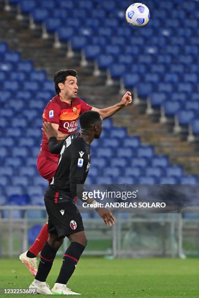 Roma's Argentine midfielder Javier Pastore and Bologna's French Malian defender Bakary Adama Soumaoro go for the ball during the Italian Serie A...