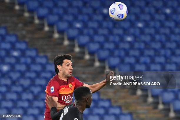Roma's Argentine midfielder Javier Pastore and Bologna's French Malian defender Bakary Adama Soumaoro go for the ball during the Italian Serie A...