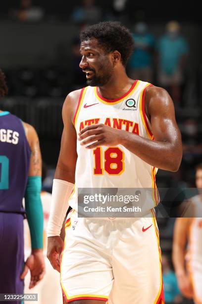 Solomon Hill of the Atlanta Hawks smiles during the game against the Charlotte Hornets on April 11, 2021 at Spectrum Center in Charlotte, North...