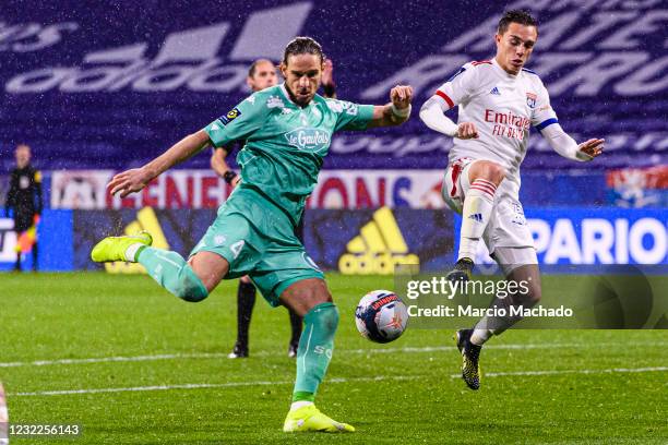 Mateo Pavlovic of Angers attempts a kick while being defended by Maxence Caqueret of Olympique Lyon during the Ligue 1 match between Olympique Lyon...