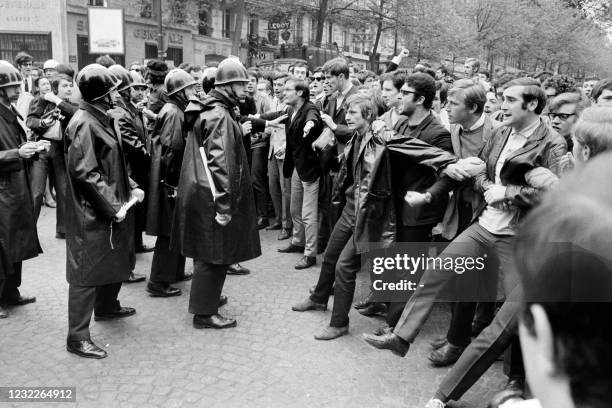 In this photo taken on May 06, 1968 protesting students face French CRS riot police charge during a demonstration near the Sorbonne University, on...