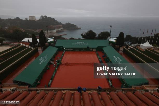 Ground covers protects the court surface as play is suspended due to rain on day two of the Monte-Carlo ATP 1000 Masters Series tennis tournament in...