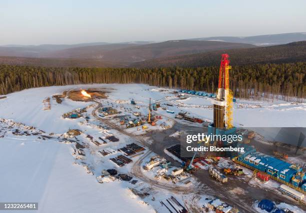 Horizontal flare stack burns beyond the Gazprom PJSC gas drilling rig in the Kovyktinskoye gas field, part of the Power of Siberia gas pipeline...