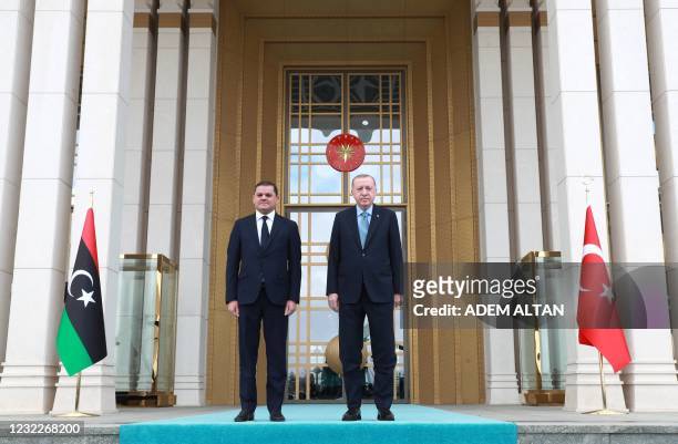 Turkish President Recep Tayyip Erdogan and Libyan government of national unity prime minister Abdul Hamid Dbeibah pose for a photo during the...