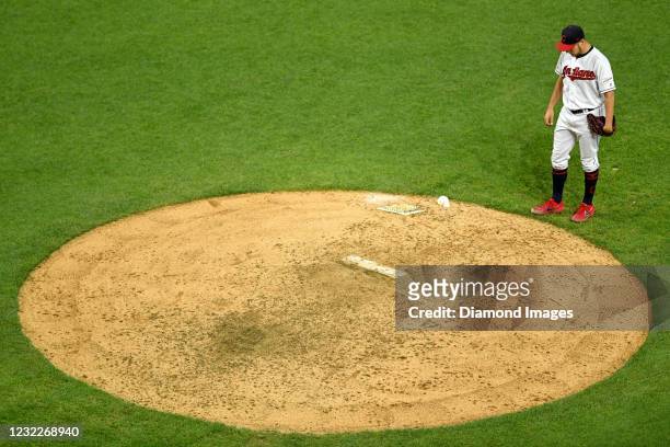 Starting pitcher Trevor Bauer of the Cleveland Indians prepares to pitch in the eighth inning of a game against the Cincinnati Reds at Progressive...