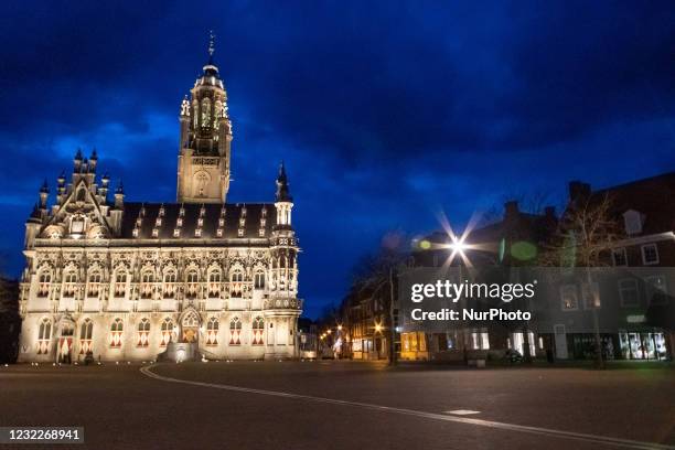 Illuminated iconic Middelburg Town Hall, one of the main monument attractions of the city sightseeing, a landmark of architecture as seen after the...