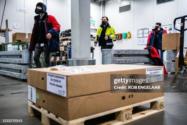 Picture taken on April 12, 2021 shows the first doses of Johnson & Johnson Janssen Covid-19 vaccine proceeding from the Dutch city of Leiden stored...