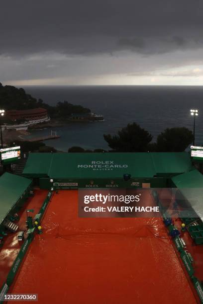 Ground covers protects the court surface as play is suspended due to rain late on day two of the Monte-Carlo ATP 1000 Masters Series tennis...