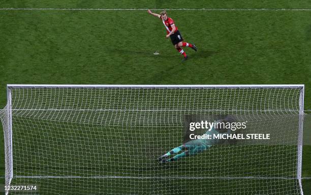 West Bromwich Albion's English goalkeeper Sam Johnston saves this late penalty kick from Southampton's English midfielder James Ward-Prowse during...