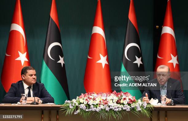 Turkish President Recep Tayyip Erdogan and Libyan Government of National Unity Prime Minister Abdul Hamid Dbeibah attend a signing ceremony after...