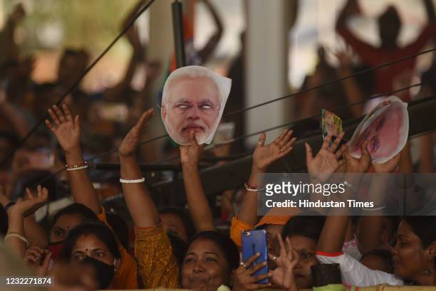 Supporters during a public rally by Prime Minister Narendra Modi for West Bengal Assembly Election at Barasat on April 12, 2021 in North 24 Parganas,...