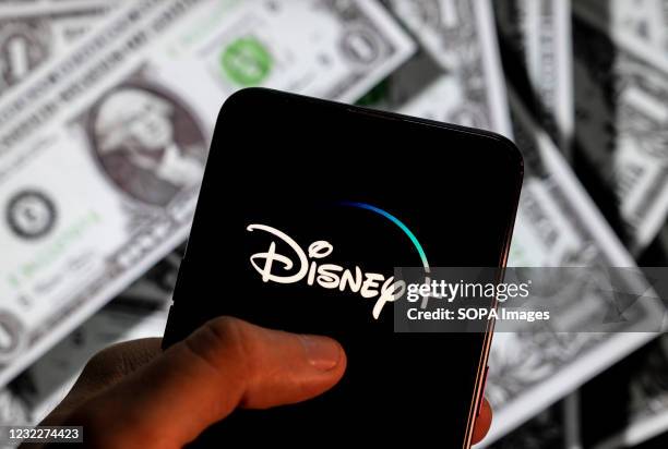 In this photo illustration, the online video streaming subscription service platform owned and operated by Disney, Disney+ , logo seen on an Android...