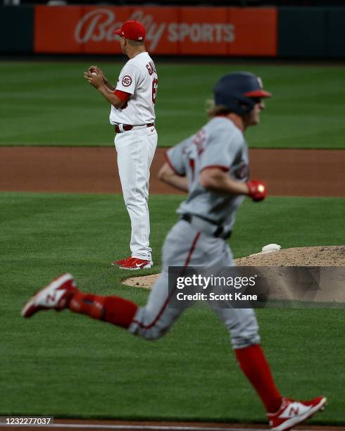 Giovanny Gallegos of the St. Louis Cardinals pauses on the mound as Andrew Stevenson of the Washington Nationals runs the bases after hitting a solo...