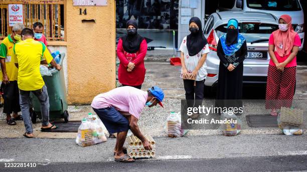 Volunteers prepare aids to send them to Rohingya refugees as Ustaz Rafik, President of Selangor Humanitarian Aid Association established to help...