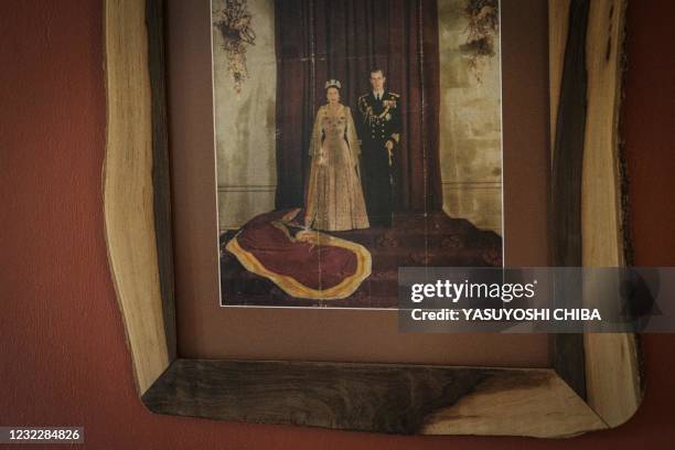 The photo on the wall shows the portrait of Britain's Queen Elizabeth II of England and Prince Philip in the suite called "Princess Elizabeth" at...