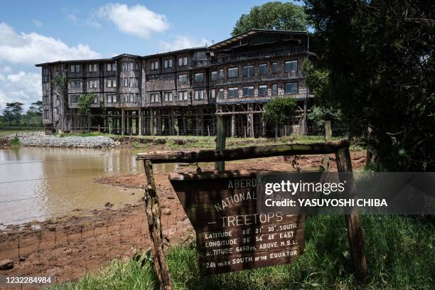 Wooden board shows the name of Treetops Lodge where Britain's Queen Elizabeth II of England stayed the night her father, the King, died and became...