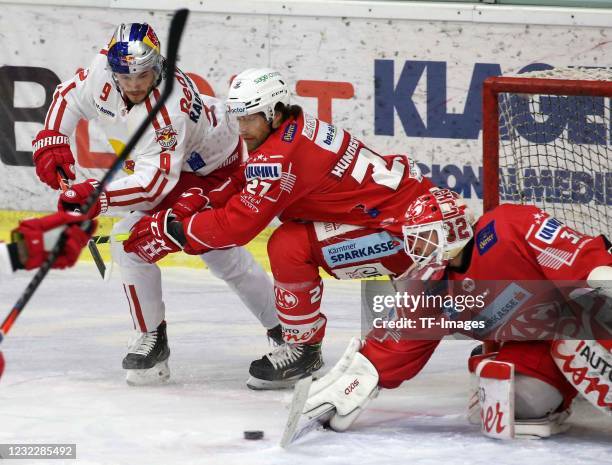 Thomas Hundertpfund, Sebastian Dahm, of EC KAC, Alexander Rauchenwald of EC Red Bull Salzburg battle for the ball during the Bet-at-home Ice Hockey...