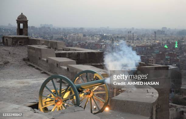 Ramadan cannon is fired to mark the breaking of the fasting during the Muslim holy month of Ramadan at the compound of the citadel in the Egyptian...