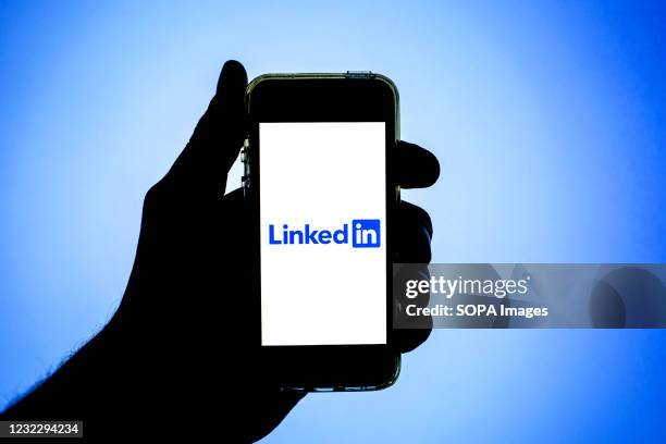 In this photo illustration the LinkedIn logo seen displayed on a smartphone screen.