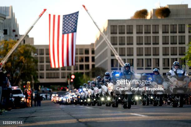 Law enforcement officers hold a procession for U.S. Capitol Police Officer William Evans on April 13, 2021 in Washington, DC. A ceremony honoring...