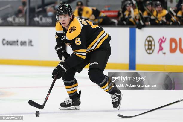 Mike Reilly of the Boston Bruins skates during with the puck in the first period of a game against the Buffalo Sabres at TD Garden on April 13, 2021...