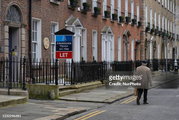 Man walks past an advertising board for offices for rent in Dublin city center, during the COVID-19 lockdown. On Tuesday, 13 April 2021, in Dublin,...
