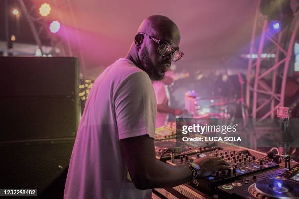 Black Coffee performs his show at Altitude Beach club in Fourways, Johannesburg, on March 21, 2021. - The 45-year old record producer and DJ has...