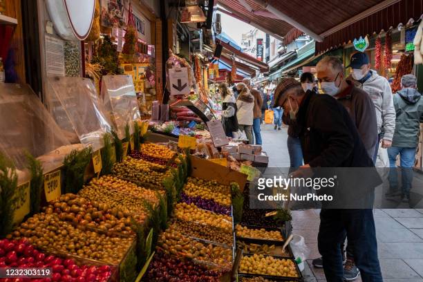 People do their shopping from the local market in the Kadikoy district of Istanbul, Turkey on the first day of fasting for the Muslim holy month of...