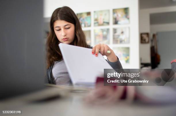 Bonn, Germany In this photo illustration a girl is sitting in front of a laptop on April 14, 2021 in Bonn, Germany.