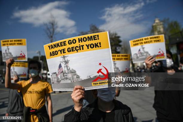 Group of protesters hold placards reading "Yankee go Home - No way to USA", in Istanbul, on April 14 during a demonstration against the US decision...