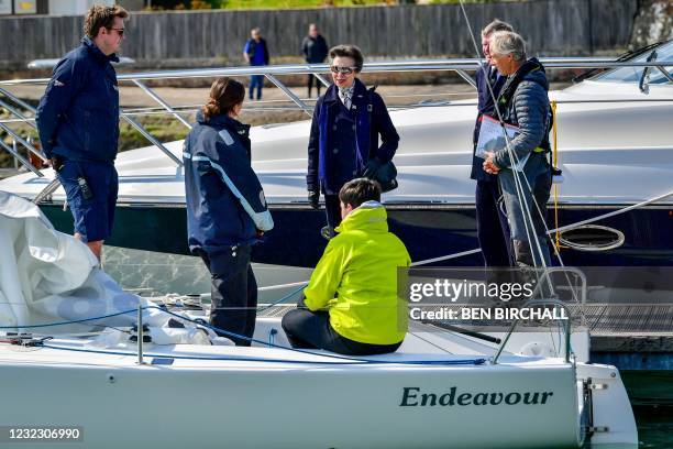Britain's Princess Anne, Princess Royal, talks with sailors on a Youth Training Programme during her visit to the Royal Victoria Yacht Club in Cowes...