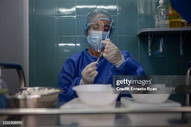 Nurse prepares a dose of the vaccines against Covid-19 at Hospital Pereira Rossell on April 14, 2021 in Montevideo, Uruguay. After cases surged in...