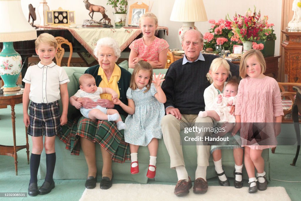 Queen Elizabeth II And Prince Philip, Duke of Edinburgh With Their Great Grandchildren