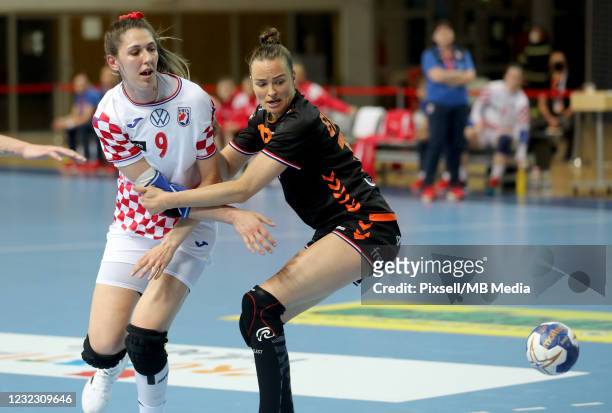 Camila Micijevic of Croatia is challenged by Yvette Broch of Netherlands during HEP Croatia Cup handball match between Croatia and Netherlands at...