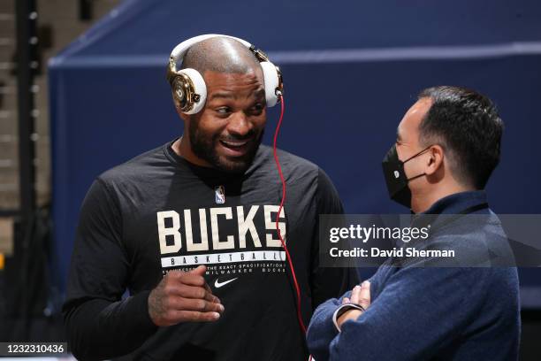 Tucker of the Milwaukee Bucks talks to President of Basketball Operations Gersson Rosas of the Minnesota Timberwolves before the game on April 14,...