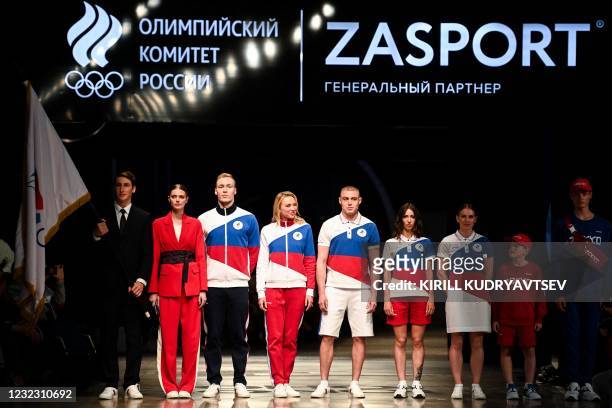 Models present the Russian Olympic Team uniform for the Tokyo 2020 Olympic Games, designed and manufactured by ZASPORT clothing company, in Moscow on...
