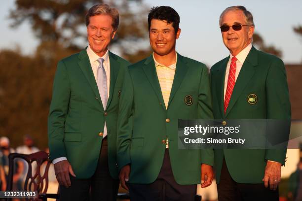 Hideki Matsuyama with Augusta Nation Chaiirmen Fred Ridley and Billy Payne wearing green jackets during ceremony after Sunday play at Augusta...