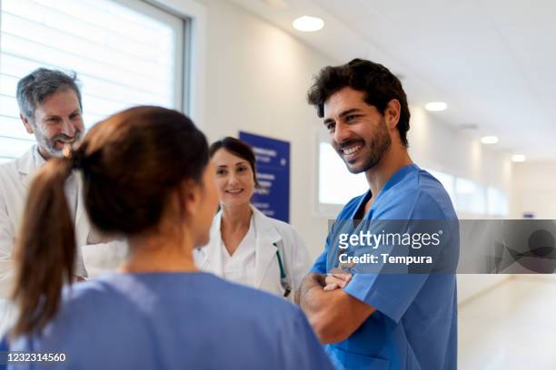 hospital health care workers in an informal meeting. - nurse candid stock pictures, royalty-free photos & images