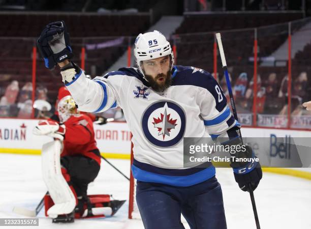 Mathieu Perreault of the Winnipeg Jets celebrates his third-period goal against the Ottawa Senators at Canadian Tire Centre on April 14, 2021 in...