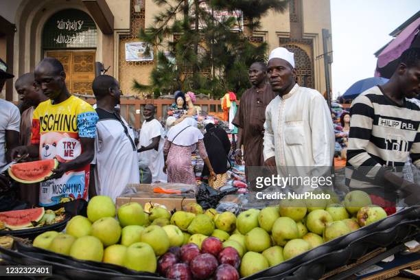 Street vendor sells watermelons/apple as he waits for customers at the entrance of the Lagos Central Mosque located along the busy Nnamdi Azikiwe...
