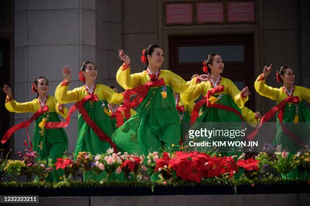 Members of the Phibada Opera Troupe performs in the Plaza of the Grand Theatre as North Korea marks the 109th birth anniversary of late leader Kim Il...