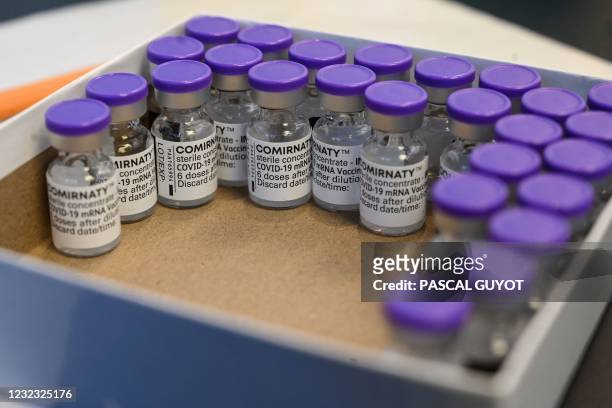 Photograph taken on April 15, 2021 shows vials of the Pfizer/BioNTech vaccine against Covid-19 during a vaccination campaign at the city hall of...