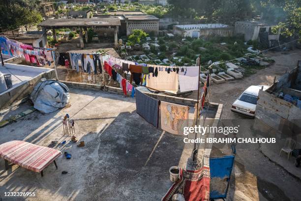 This picture taken on April 14, 2021 shows an elevated view of a laundry line hung up by marginalised resident families of the Ghoraba cemetery,...