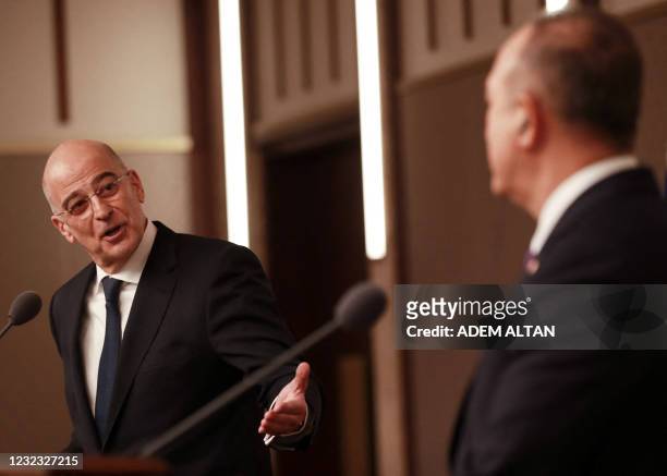 Turkish Foreign Minister Mevlut Cavusoglu and Greek Foreign Minister Nikos Dendias hold a press conference following their meeting in Ankara on April...